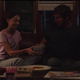 Sarah hands Joel a box containing a birthday present in a moment from HBO's The Last of Us.